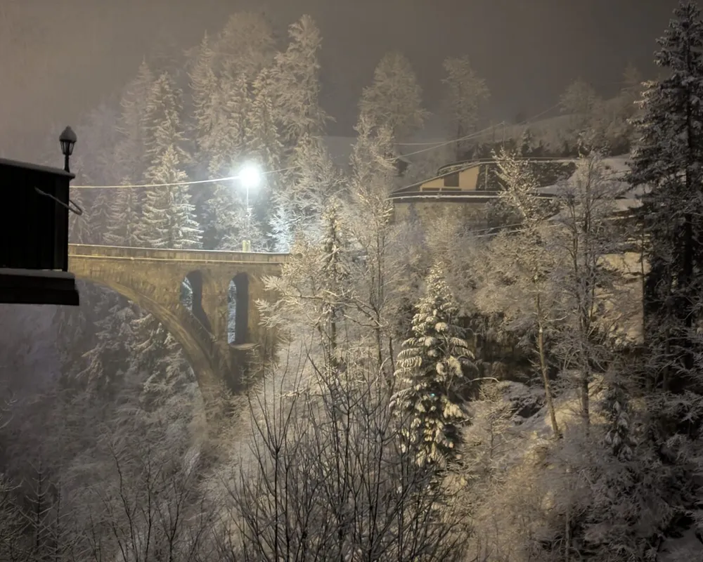 A bridge at night in a snowstorm
